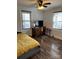 Bedroom featuring wood floors, a large window, and dresser at 827 W Horah St, Salisbury, NC 28144