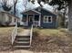 Charming home featuring inviting front porch, stylish shutters, and well-maintained landscaping at 827 W Horah St, Salisbury, NC 28144
