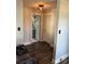 Hallway with hardwood floors leading to the bathroom and other rooms at 827 W Horah St, Salisbury, NC 28144