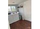 Bright laundry room with a large window, modern washer and dryer, and storage for laundry supplies, making chores easier at 827 W Horah St, Salisbury, NC 28144