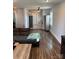 Bright living room showcasing hardwood floors, a glimpse into the kitchen, and ample natural light at 827 W Horah St, Salisbury, NC 28144