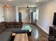 Spacious living room with hardwood floors offering a view into the kitchen area at 827 W Horah St, Salisbury, NC 28144