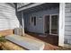 Backyard view featuring a patio with sliding glass doors, partial shade and an air conditioner unit at 9129 Troon Ln # C, Charlotte, NC 28214