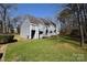Charming townhouse featuring gray siding, a grassy lawn, and a clear blue sky at 9129 Troon Ln # C, Charlotte, NC 28214