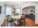 Elegant dining room with a round table, chandelier, and stylish decor, perfect for Gathering gatherings at 9325 Beecroft Valley Dr, Huntersville, NC 28078