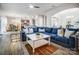 Spacious living room featuring hardwood floors, a large sectional sofa, and an open-concept design at 9325 Beecroft Valley Dr, Huntersville, NC 28078