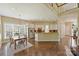 Large open kitchen with white cabinets and a breakfast bar is perfect for entertaining at 100 Cliveden Ct, Belmont, NC 28012