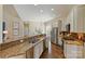 Bright kitchen with granite countertops, stainless steel appliances, and an open layout to the dining area at 100 Cliveden Ct, Belmont, NC 28012
