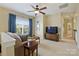 Upper living space with a comfortable couch, a television, and good natural light at 100 Cliveden Ct, Belmont, NC 28012