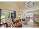 Open floor plan with living room, dining area, and kitchen creates a seamless and inviting living space at 100 Cliveden Ct, Belmont, NC 28012