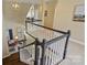 View of the staircase with white rails and neutral walls leading to the upper level at 100 Cliveden Ct, Belmont, NC 28012