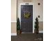 Apartment 219 front door decorated with a sunflower wreath at 1000 E Woodlawn Rd, Charlotte, NC 28209