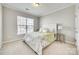 Inviting bedroom with neutral tones, a queen bed, and bright natural light, creating a serene atmosphere at 10014 Berkeley Castle Dr, Charlotte, NC 28273