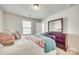 Inviting bedroom features a large window, dresser with mirror, and comfortable bed at 10014 Berkeley Castle Dr, Charlotte, NC 28273
