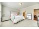 Comfortable bedroom with neutral walls, a queen bed, and an ensuite bathroom, offering a relaxing retreat at 10014 Berkeley Castle Dr, Charlotte, NC 28273