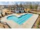 Aerial view of a community pool with a sundeck and mature landscaping at 10014 Berkeley Castle Dr, Charlotte, NC 28273
