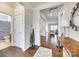 Bright entryway with wood floors, leading to the living spaces at 10014 Berkeley Castle Dr, Charlotte, NC 28273