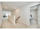 Bright hallway with carpet floors leads to bedrooms and living spaces, offering easy access throughout the home at 10014 Berkeley Castle Dr, Charlotte, NC 28273