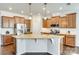 Gourmet kitchen with stainless steel appliances, granite counters, and dark wood cabinets at 10014 Berkeley Castle Dr, Charlotte, NC 28273