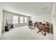 Comfortable living room with large windows, plush seating, and stylish decor at 10014 Berkeley Castle Dr, Charlotte, NC 28273