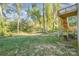 A spacious backyard features a deck with stairs and natural landscape at 1006 W B St, Kannapolis, NC 28081
