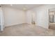 Cozy bedroom with neutral carpet and an ensuite bathroom, providing a comfortable and private living space at 1006 W B St, Kannapolis, NC 28081