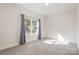 Bright and airy bedroom with large windows and neutral carpet, providing a comfortable and relaxing space at 1006 W B St, Kannapolis, NC 28081