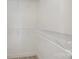 Organized walk-in closet with white wire shelving, providing ample storage space and keeping belongings neatly arranged at 1006 W B St, Kannapolis, NC 28081