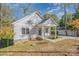 Well-maintained home featuring a covered porch and sidewalk leading to the entrance at 1006 W B St, Kannapolis, NC 28081