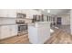 Bright kitchen showcasing stainless steel appliances, granite countertops, and a functional island, creating a modern cooking space at 1006 W B St, Kannapolis, NC 28081
