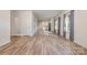 Spacious living room featuring hardwood floors, neutral walls, and access to the kitchen at 1006 W B St, Kannapolis, NC 28081