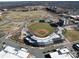 Aerial view showcasing a baseball stadium, surrounding buildings, and fields at 108 Oak Grove St, Kannapolis, NC 28081