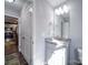Bright bathroom view shows sink, toilet, and storage in the cabinets and nearby hallway closet at 108 Oak Grove St, Kannapolis, NC 28081