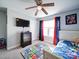 Bright bedroom featuring ceiling fan, area rug, and natural light at 108 Oak Grove St, Kannapolis, NC 28081