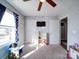 A bedroom offering natural light, a ceiling fan, and neutral paint at 108 Oak Grove St, Kannapolis, NC 28081