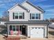 Charming two-story home with black shutters and a cozy front porch, offering a welcoming curb appeal at 108 Oak Grove St, Kannapolis, NC 28081