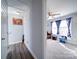 Hallway that leads to a bedroom with a large window that offers natural light at 108 Oak Grove St, Kannapolis, NC 28081