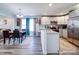 Bright kitchen with stainless steel appliances, granite countertops, and a view to the dining area at 108 Oak Grove St, Kannapolis, NC 28081