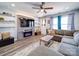 Cozy living room with a modern fireplace, floating shelves, and a comfortable sectional sofa at 108 Oak Grove St, Kannapolis, NC 28081