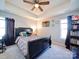 This main bedroom features a ceiling fan, carpeted floors, and cozy decor at 108 Oak Grove St, Kannapolis, NC 28081