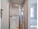 Bright shower with glass enclosure, built-in shelving, bronze trim, and a clean, modern design at 108 Oak Grove St, Kannapolis, NC 28081