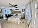 Bright and airy bedroom with a ceiling fan, large window, and elegant decor at 109 Stroupe Rd # E, Gastonia, NC 28056