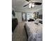 Inviting bedroom with a ceiling fan, mirrored closet doors, and ample space for relaxation at 109 Stroupe Rd # E, Gastonia, NC 28056