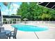 Large community pool with shaded areas and ample seating for residents at 109 Stroupe Rd # E, Gastonia, NC 28056