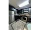Modern kitchen featuring stainless steel appliances and sleek black cabinetry at 109 Stroupe Rd # E, Gastonia, NC 28056