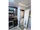 Efficient kitchen layout with stainless steel appliances and a convenient laundry closet at 109 Stroupe Rd # E, Gastonia, NC 28056