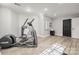 Basement exercise area with modern fitness equipment, a sleek mirror, and stylish decor at 11001 Valley Spring Dr, Charlotte, NC 28277