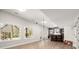 Finished basement featuring a bar area, hardwood floors, natural light, and ample space at 11001 Valley Spring Dr, Charlotte, NC 28277