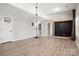 Spacious basement with modern flooring, climbing apparatus, and a chalkboard for recreation and activities at 11001 Valley Spring Dr, Charlotte, NC 28277