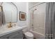 Bathroom with shower and tub, stylish mirror, and modern vanity at 11001 Valley Spring Dr, Charlotte, NC 28277